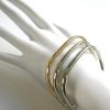 CARTIER, by Dinh Van, A Group of Gold Bangle Bracelets, c 1970 - Image 4